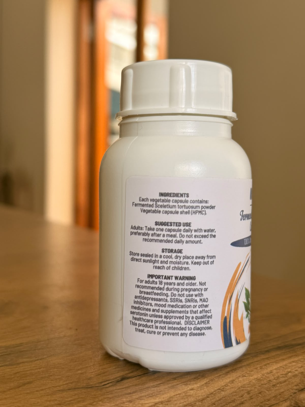 Mo’s Fermented Sceletium capsule bottle on a wooden surface